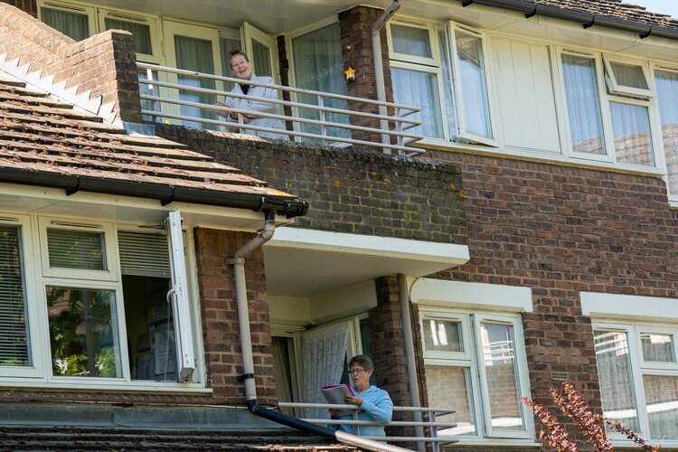 Residents sing from their balconies as part of a&nbsp;See Through&nbsp;Theatre cabaret, 2020&nbsp;