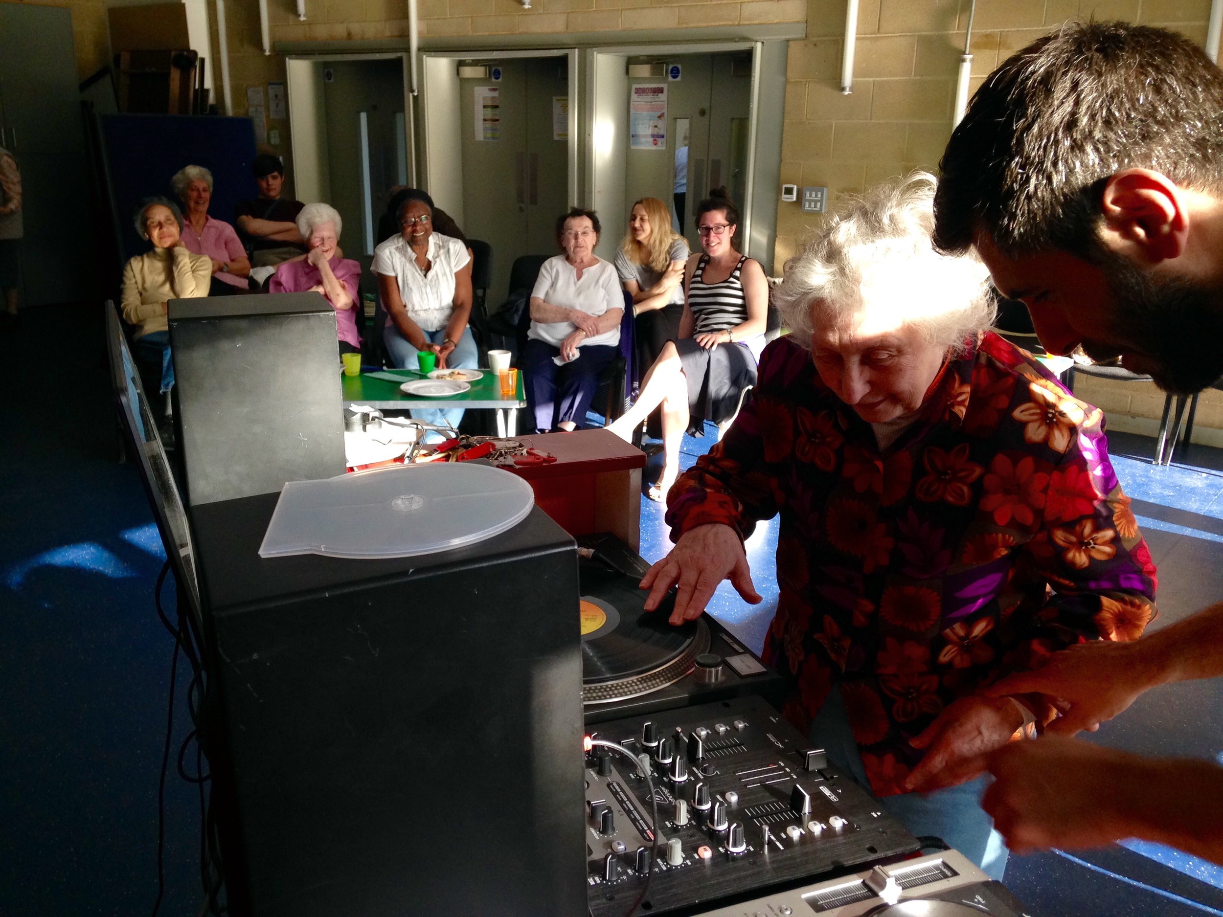 NLC Older lady DJing at Decks.jpg